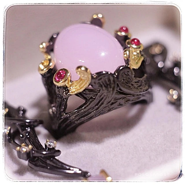 Gothic rings for women, vintage jewelry with fuchsia pink oval zirconia, black and gold color.